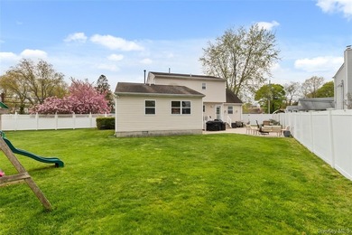 This beautifully renovated Colonial in East Islip sits on an - photo 20