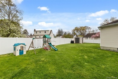 This beautifully renovated Colonial in East Islip sits on an - photo 21