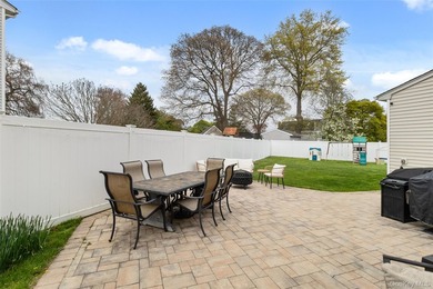 This beautifully renovated Colonial in East Islip sits on an - photo 23