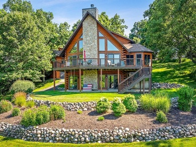 Tucked into a quiet bay with 152 feet of waterfront, this - photo 1