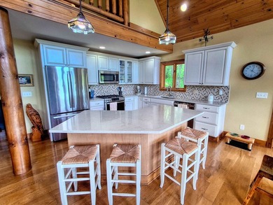 Tucked into a quiet bay with 152 feet of waterfront, this - photo 5