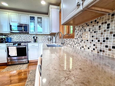 Tucked into a quiet bay with 152 feet of waterfront, this - photo 6