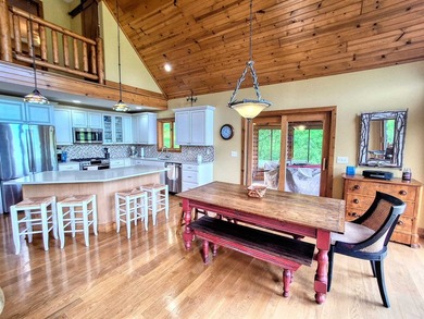 Tucked into a quiet bay with 152 feet of waterfront, this - photo 7