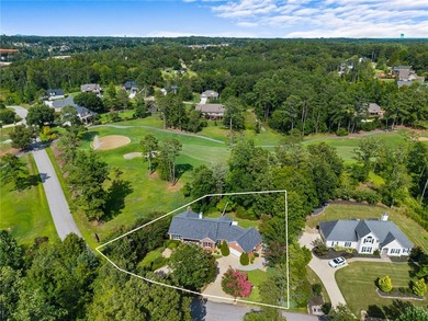 Nestled on the 12th hole in the gated community of Cross Creek - photo 3
