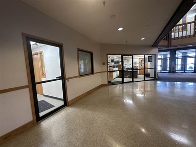 This large office offers 14 private offices, enclosed reception - photo 3