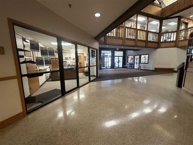 This large office offers 14 private offices, enclosed reception - photo 4