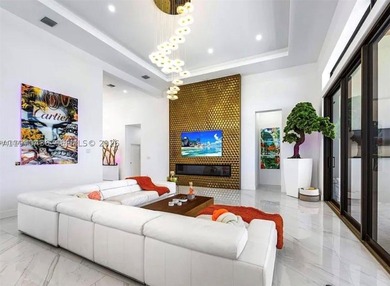 Stunning 4BR/4.5BA waterfront home in gated Bal Harbour. Nearly - photo 15