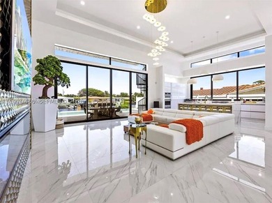 Stunning 4BR/4.5BA waterfront home in gated Bal Harbour. Nearly - photo 17