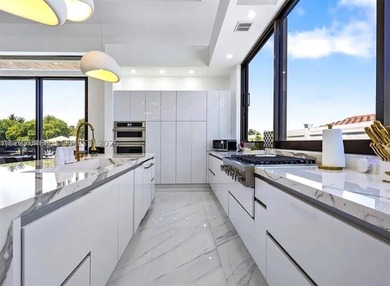 Stunning 4BR/4.5BA waterfront home in gated Bal Harbour. Nearly - photo 20