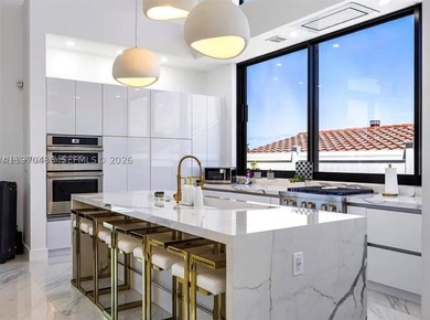 Stunning 4BR/4.5BA waterfront home in gated Bal Harbour. Nearly - photo 24