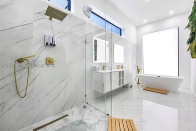 Stunning 4BR/4.5BA waterfront home in gated Bal Harbour. Nearly - photo 32