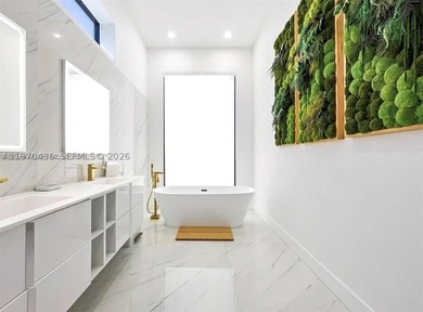 Stunning 4BR/4.5BA waterfront home in gated Bal Harbour. Nearly - photo 33