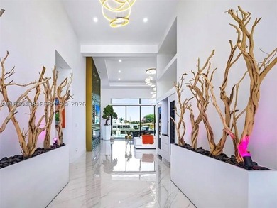 Stunning 4BR/4.5BA waterfront home in gated Bal Harbour. Nearly - photo 37