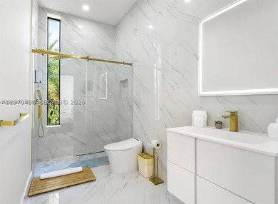 Stunning 4BR/4.5BA waterfront home in gated Bal Harbour. Nearly - photo 39