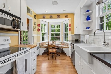 Nestled on a picturesque, wooded lot, this charming Cape Cod is - photo 14