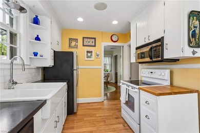 Nestled on a picturesque, wooded lot, this charming Cape Cod is - photo 16