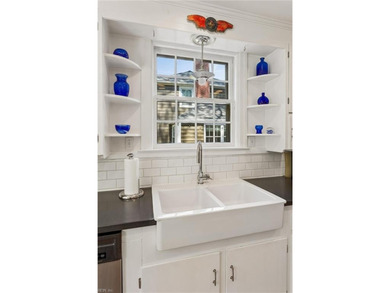 Nestled on a picturesque, wooded lot, this charming Cape Cod is - photo 18