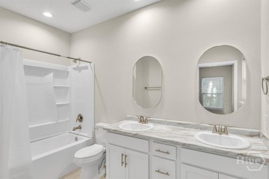Newly constructed in 2024, this modern 3BR/2.5BA home offers an - photo 11