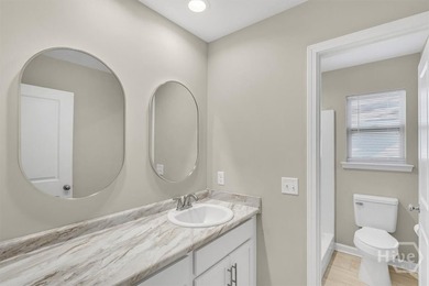 Newly constructed in 2024, this modern 3BR/2.5BA home offers an - photo 17