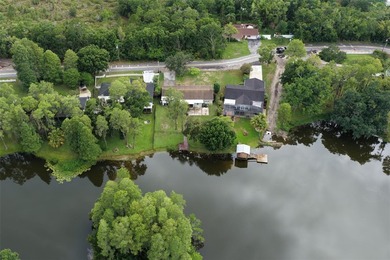 Virtually Staged. Welcome to this serene lakefront home on - photo 33