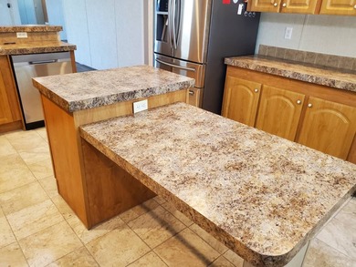 THIS HOME IS ON LEASED LAND WITH A MONTHLY LOT RENT OF $542 AND - photo 14
