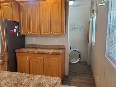 THIS HOME IS ON LEASED LAND WITH A MONTHLY LOT RENT OF $542 AND - photo 16