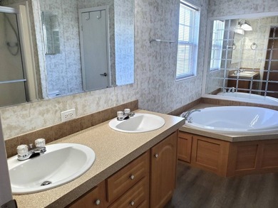 THIS HOME IS ON LEASED LAND WITH A MONTHLY LOT RENT OF $542 AND - photo 48