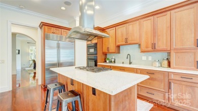 Enjoy luxurious gated living in this European inspired enclave