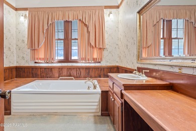 Set on 27 wooded acres in Lafayette, LA, this rare private - photo 12