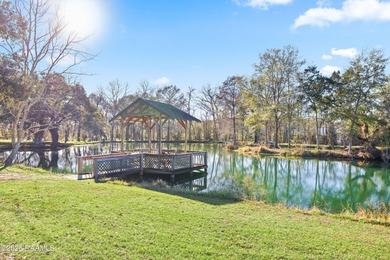 Set on 27 wooded acres in Lafayette, LA, this rare private - photo 14