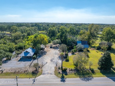 Set on 27 wooded acres in Lafayette, LA, this rare private - photo 15