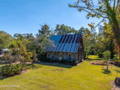 Set on 27 wooded acres in Lafayette, LA, this rare private - photo 16