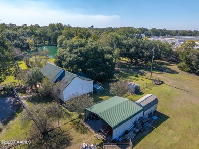 Set on 27 wooded acres in Lafayette, LA, this rare private - photo 18