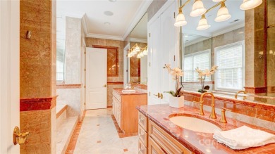 Enjoy luxurious gated living in this European inspired enclave