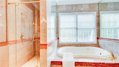 Enjoy luxurious gated living in this European inspired enclave