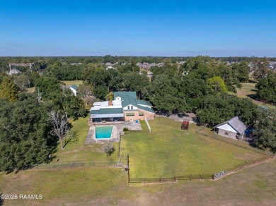 Set on 27 wooded acres in Lafayette, LA, this rare private - photo 21