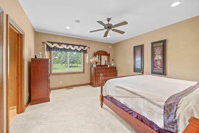 This stately patio home built by Larson Builders overlooks the - photo 21