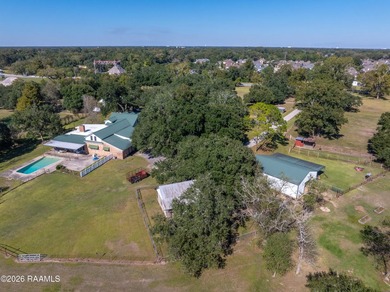 Set on 27 wooded acres in Lafayette, LA, this rare private - photo 22