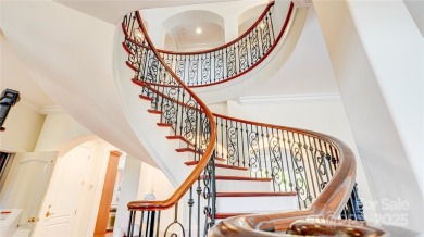 Enjoy luxurious gated living in this European inspired enclave