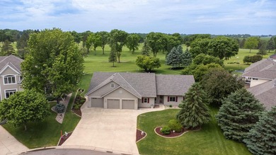 This stately patio home built by Larson Builders overlooks the - photo 34