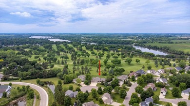 This stately patio home built by Larson Builders overlooks the - photo 36