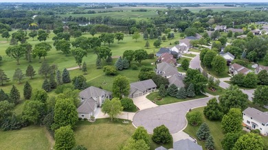 This stately patio home built by Larson Builders overlooks the - photo 42