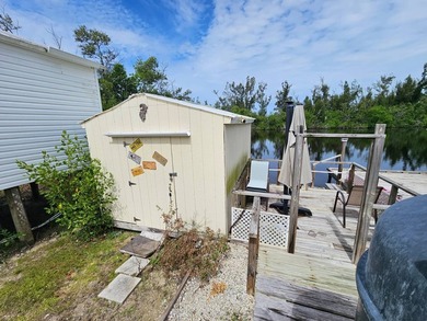 This home is situated directly on the water! Amazing location - photo 20