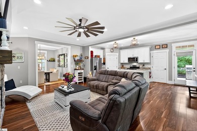An oversized covered front porch with stained wood ceilings sets - photo 11