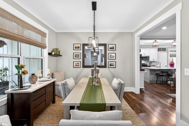 An oversized covered front porch with stained wood ceilings sets - photo 14