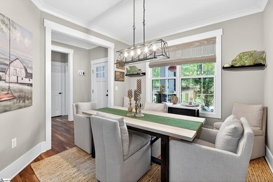 An oversized covered front porch with stained wood ceilings sets - photo 15