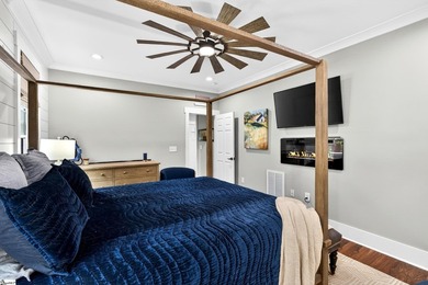 An oversized covered front porch with stained wood ceilings sets - photo 17