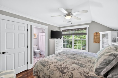 An oversized covered front porch with stained wood ceilings sets - photo 23