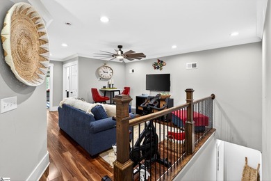 An oversized covered front porch with stained wood ceilings sets - photo 25