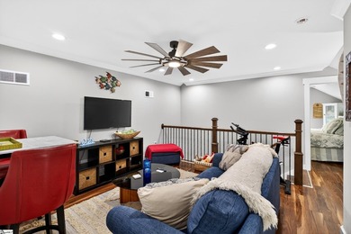 An oversized covered front porch with stained wood ceilings sets - photo 26